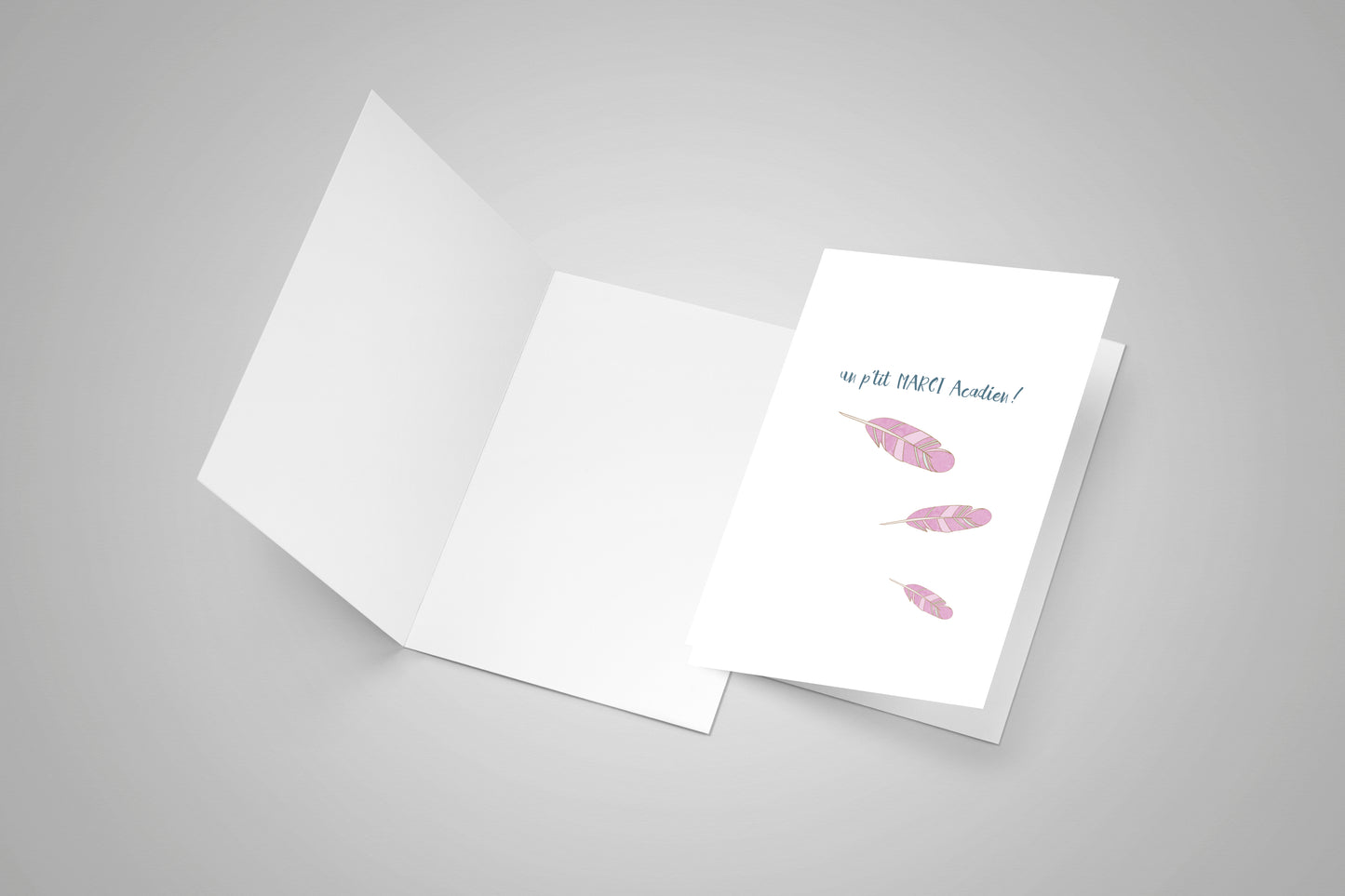 A blank card and a closed card with an Acadian thank you on the front.