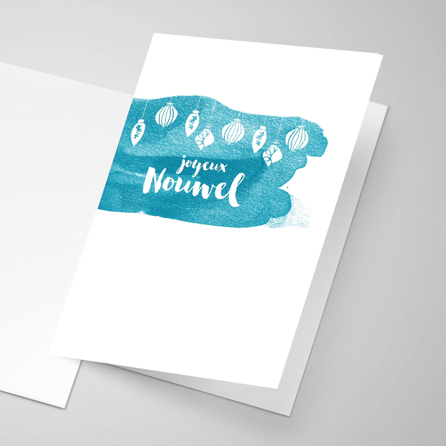A water colour style greeting card with Merry Christmas written in Acadian fashion.