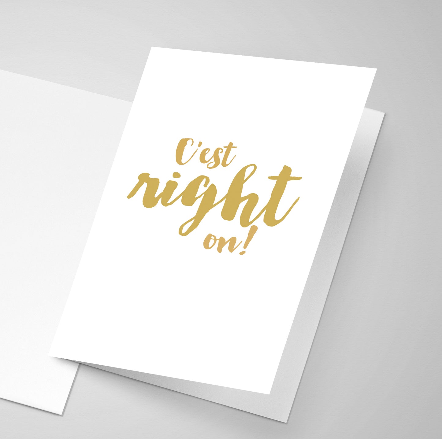 A simple closed greeting card with an French Acadian saying on the front.
