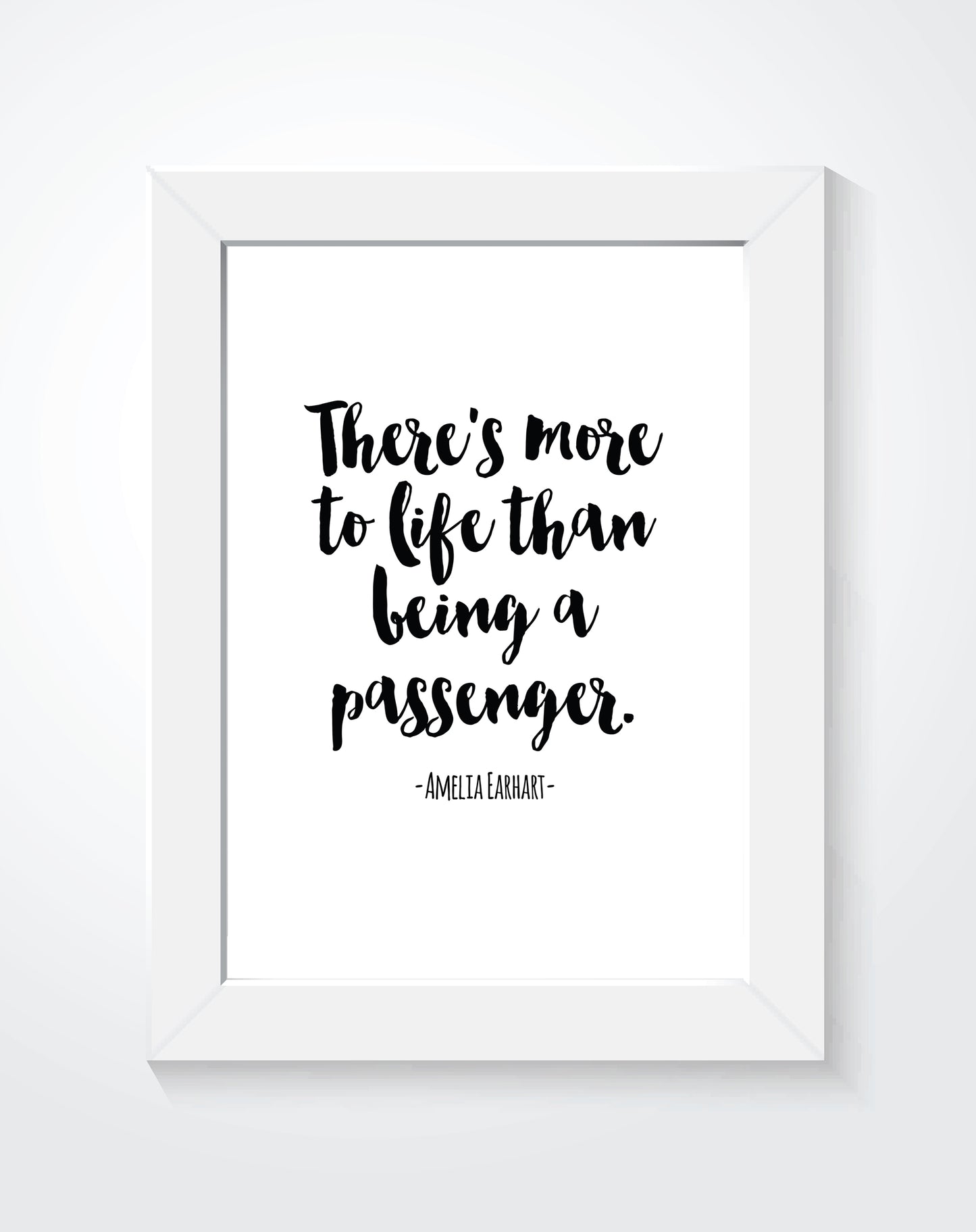 A quote by Amelia Earhart saying "There is more to life than being a passenger" printed in a white frame.
