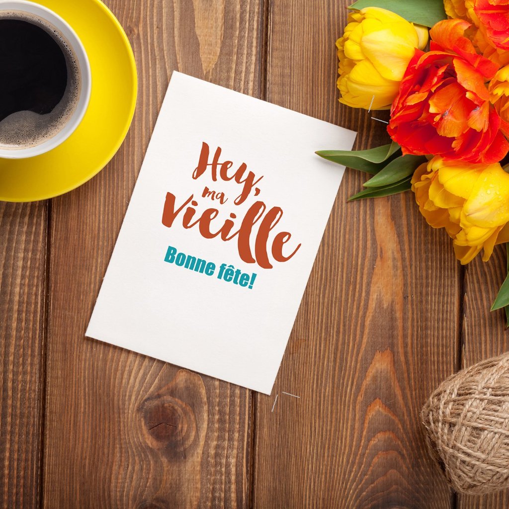 An Acadian birthday saying on a card surrounded with flowers and coffee.