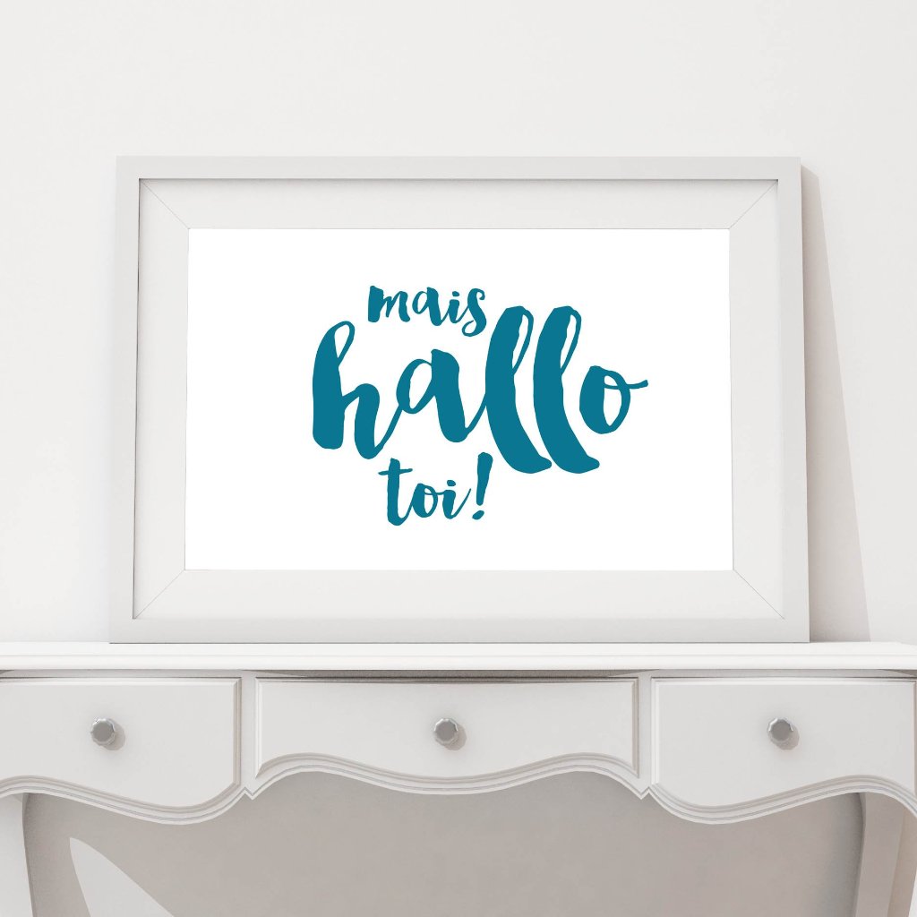 A mais hello toi Acadien/Acadian print in a white frame on a table.