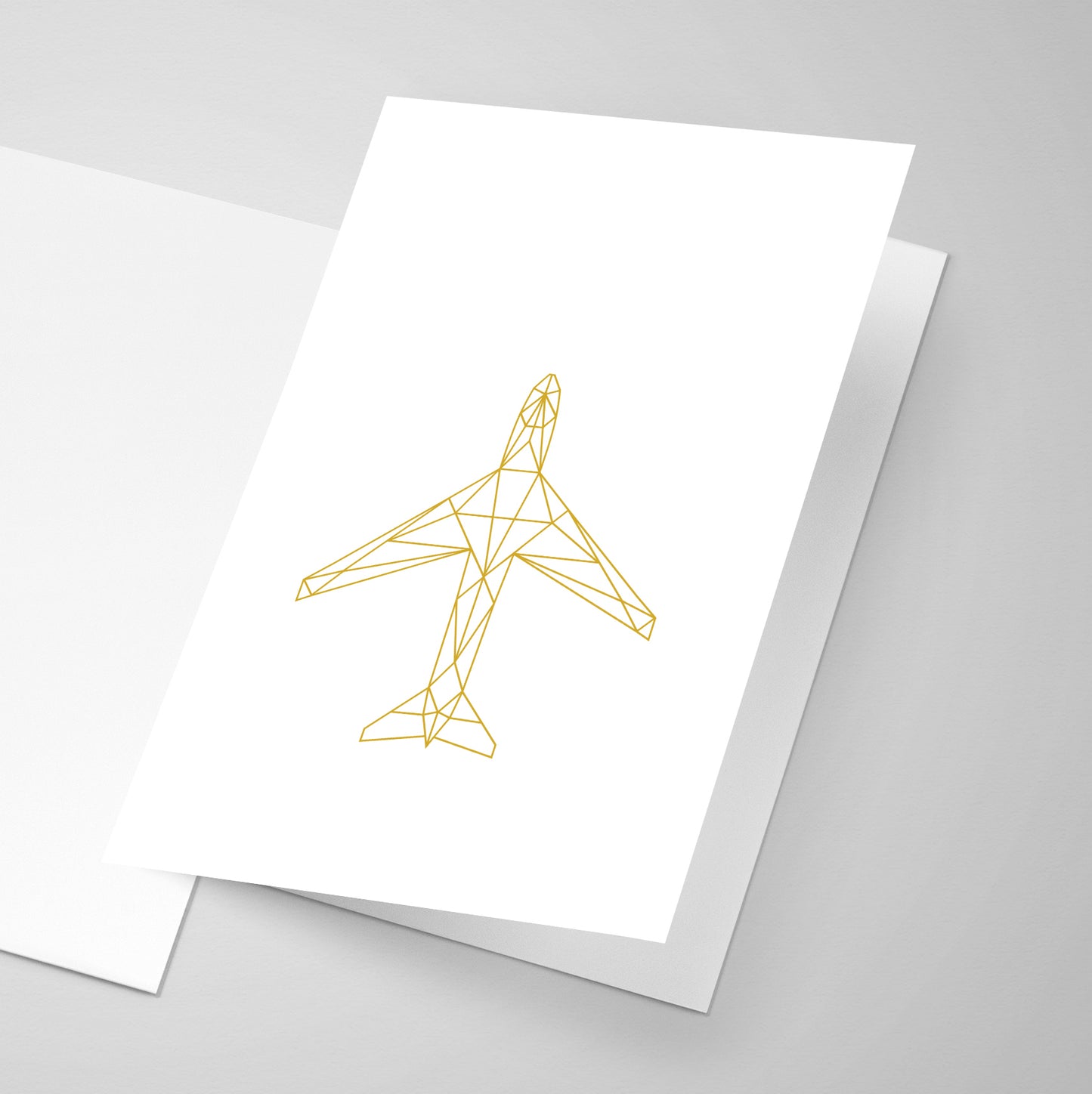 A geometric illustration of an aircraft on the front of a greeting card.