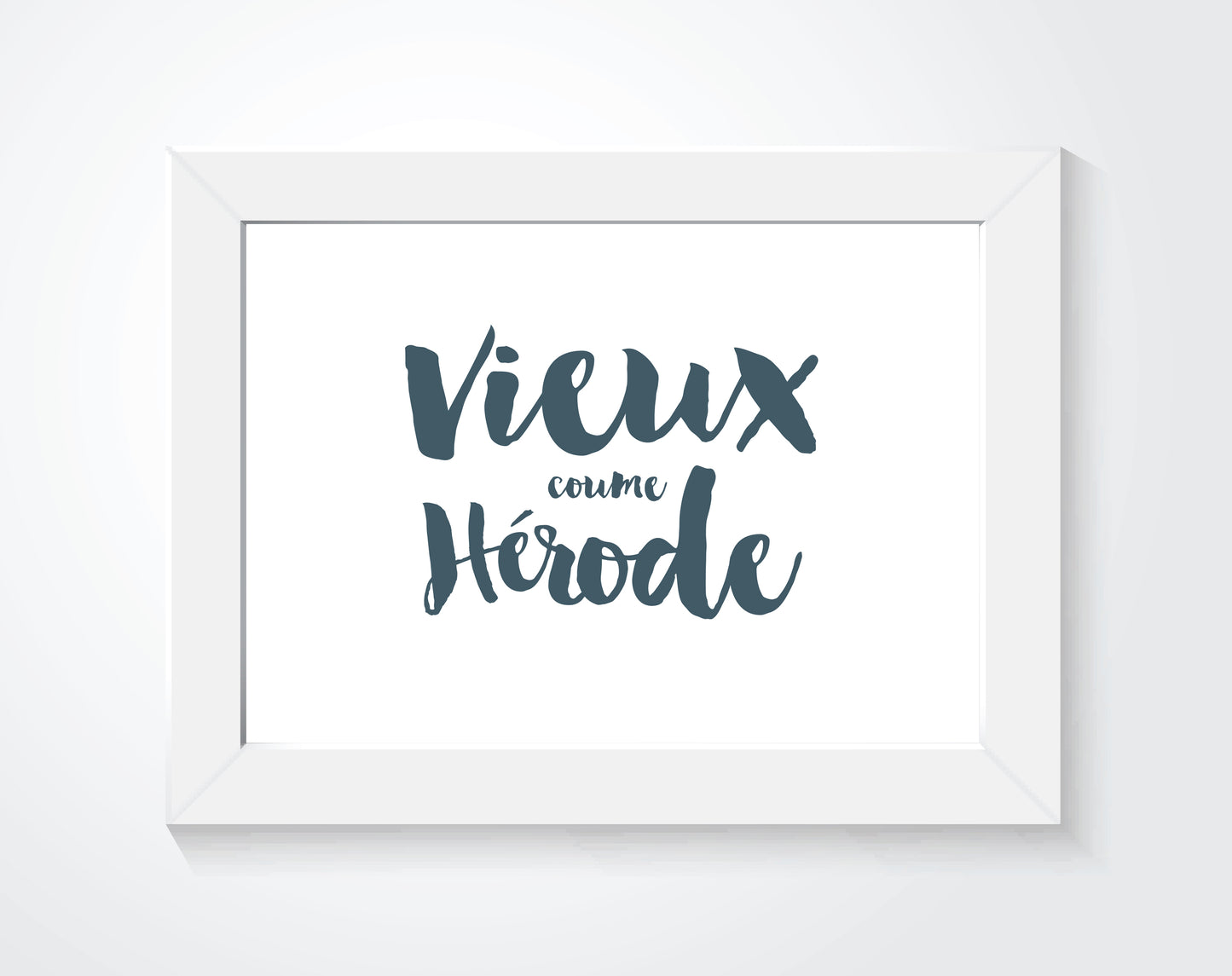 An Acadian art print in a white frame.