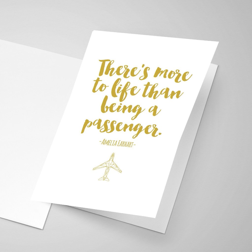 Amelia Earhart quote greeting card with yellow font and her quote saying "There is more to life than being a passenger."