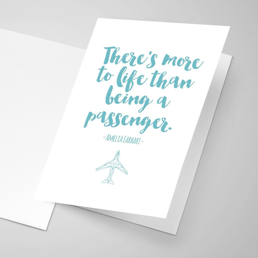 Amelia Earhart quote greeting card with teal font and her quote saying "There is more to life than being a passenger."