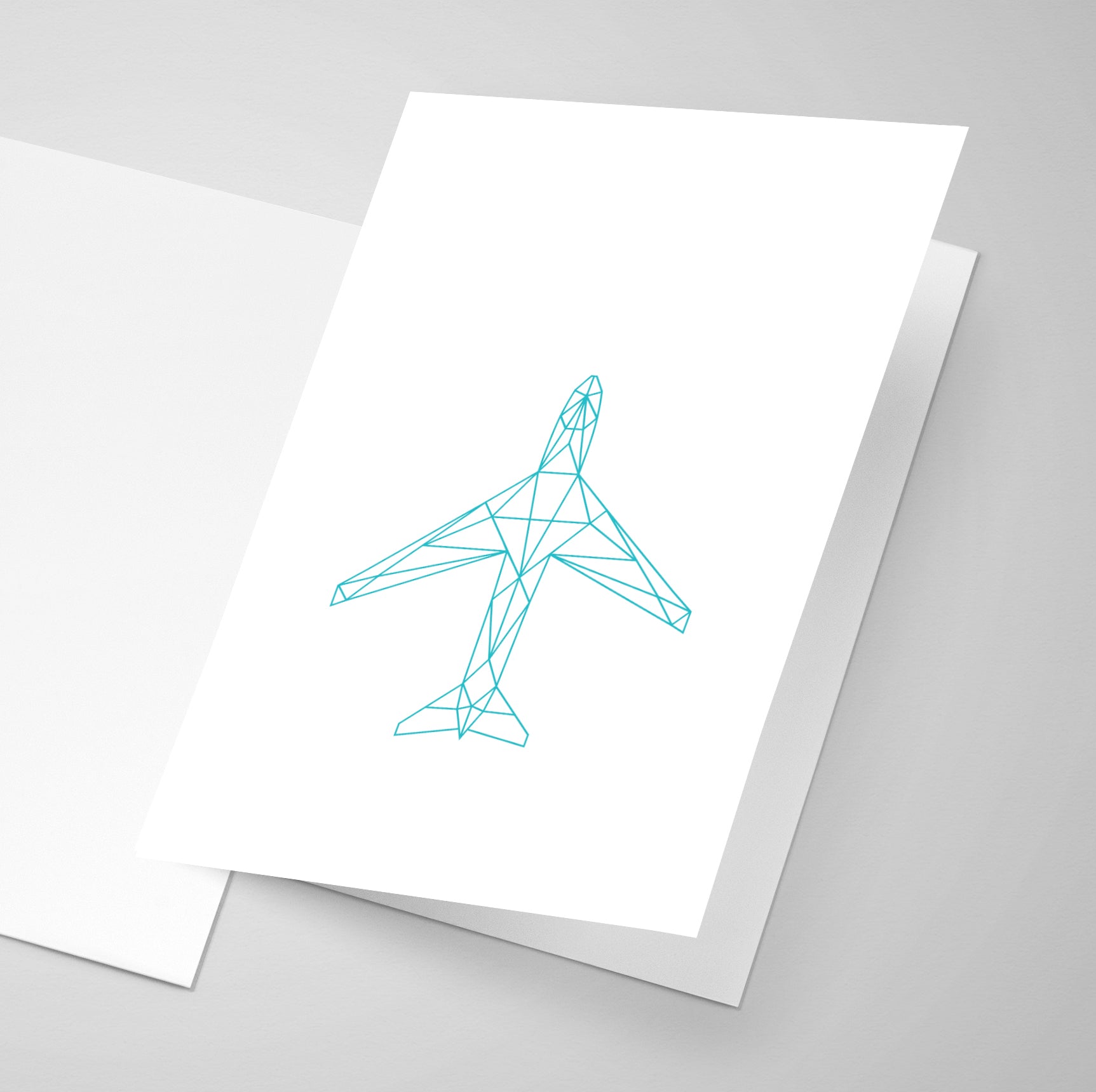 A geometric styled printed aircraft on a greeting card.