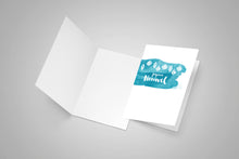 One blank greeting card and a second card with Merry Christmas on the front written in Acadian french.