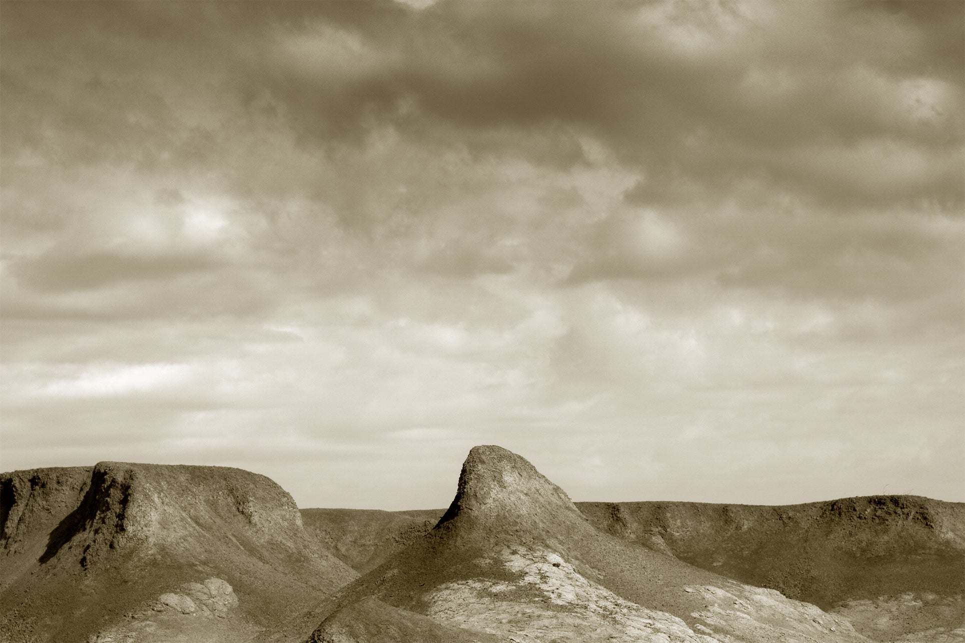 A photograph of the desert in sepia tones.