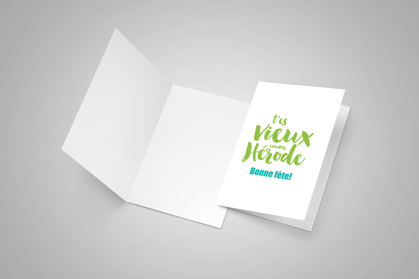 A blank greeting card and a second card with Acadian french saying.