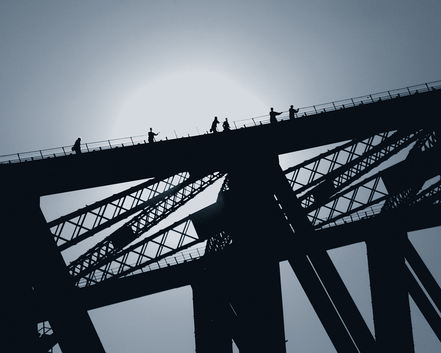 Photograph of a silhouetted bridge.