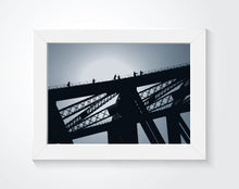 Bridge photo that is framed on the wall.