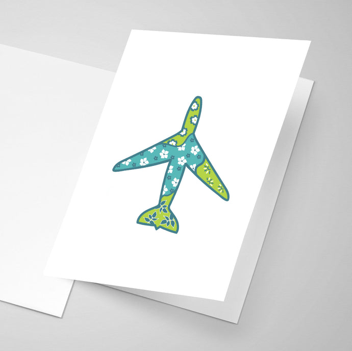 A greeting card with a floral patterned aircraft illustration on the front.